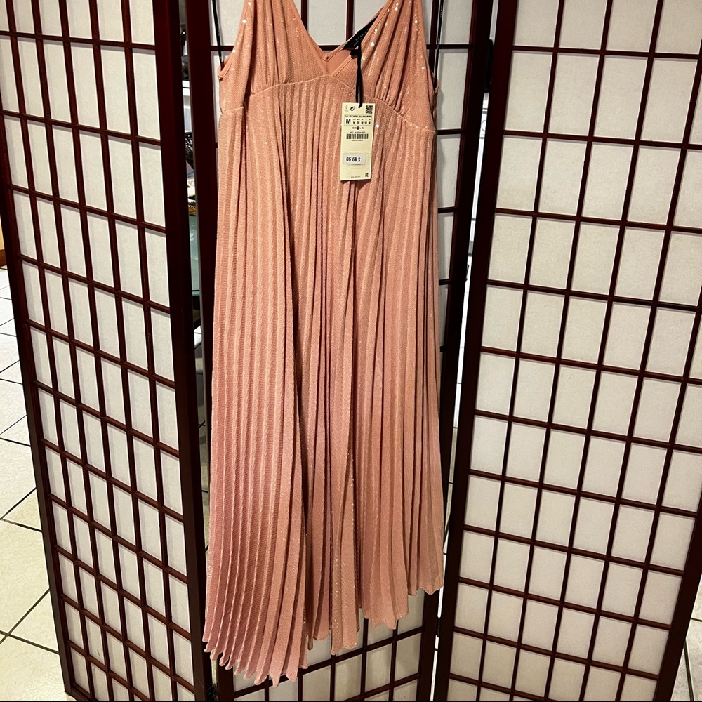 New with ticket. Sequins around pleated midi dress